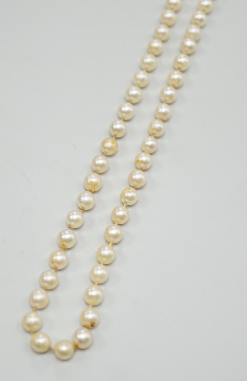 A single strand cultured pearl necklace, with 9ct white gold and diamond chip set clasp, 80cm.